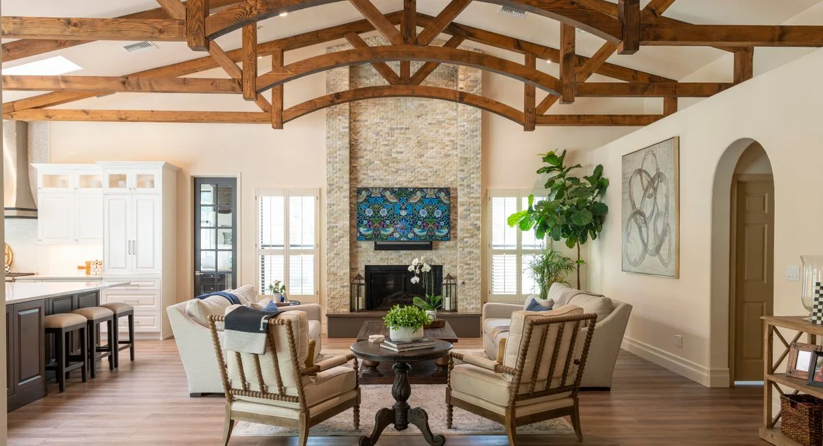 Bright and stylish living room featuring rustic wooden beams and modern design elements.