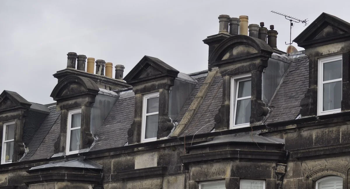 Classic Edinburgh architecture featuring historic dormer windows and slate roofs.