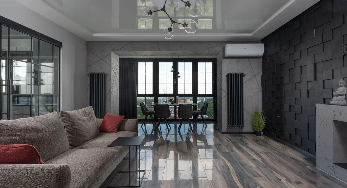 Sleek and modern living room featuring elegant furniture and city views.